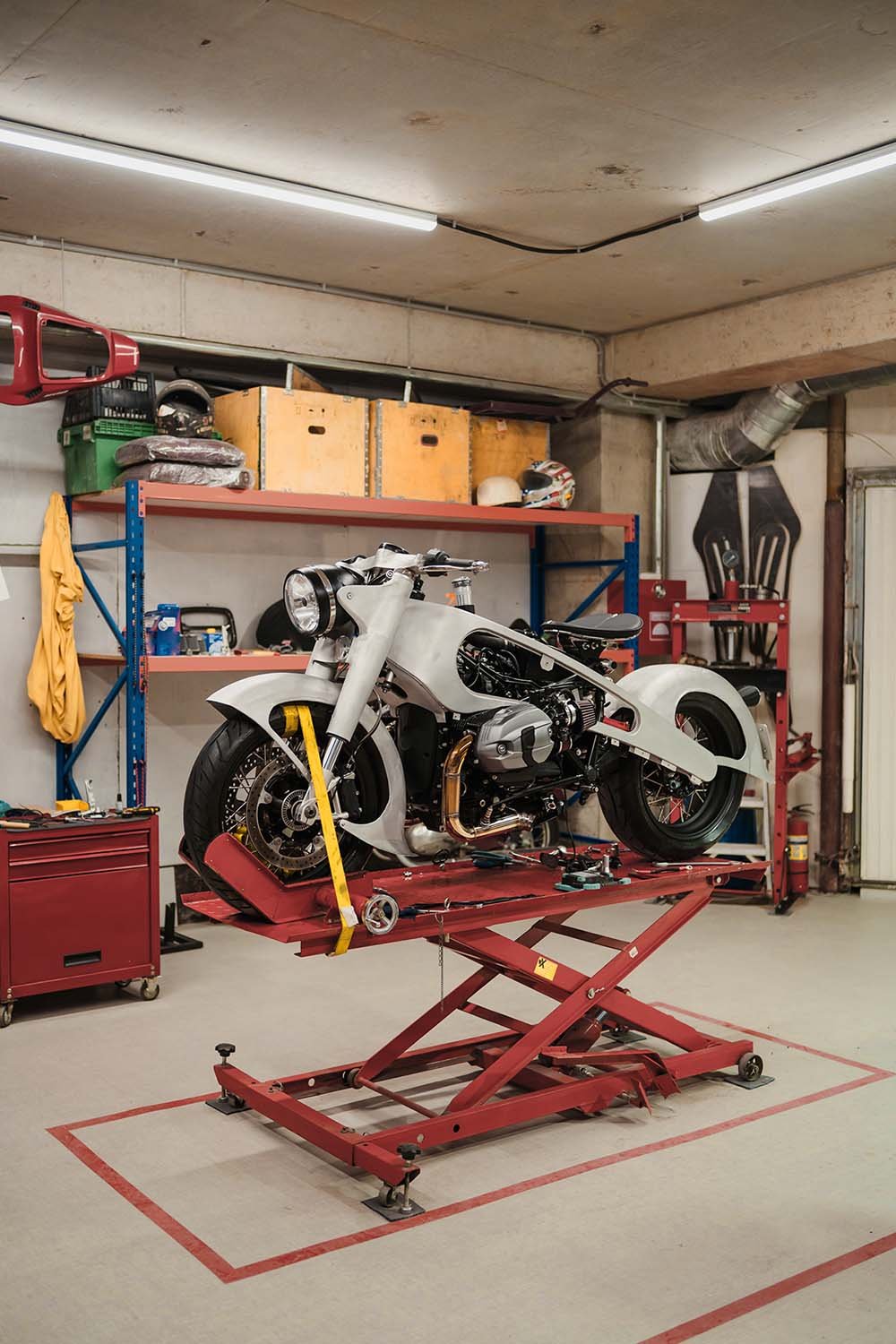 Motorcycle on a work stand inside Machnify Garage workshop